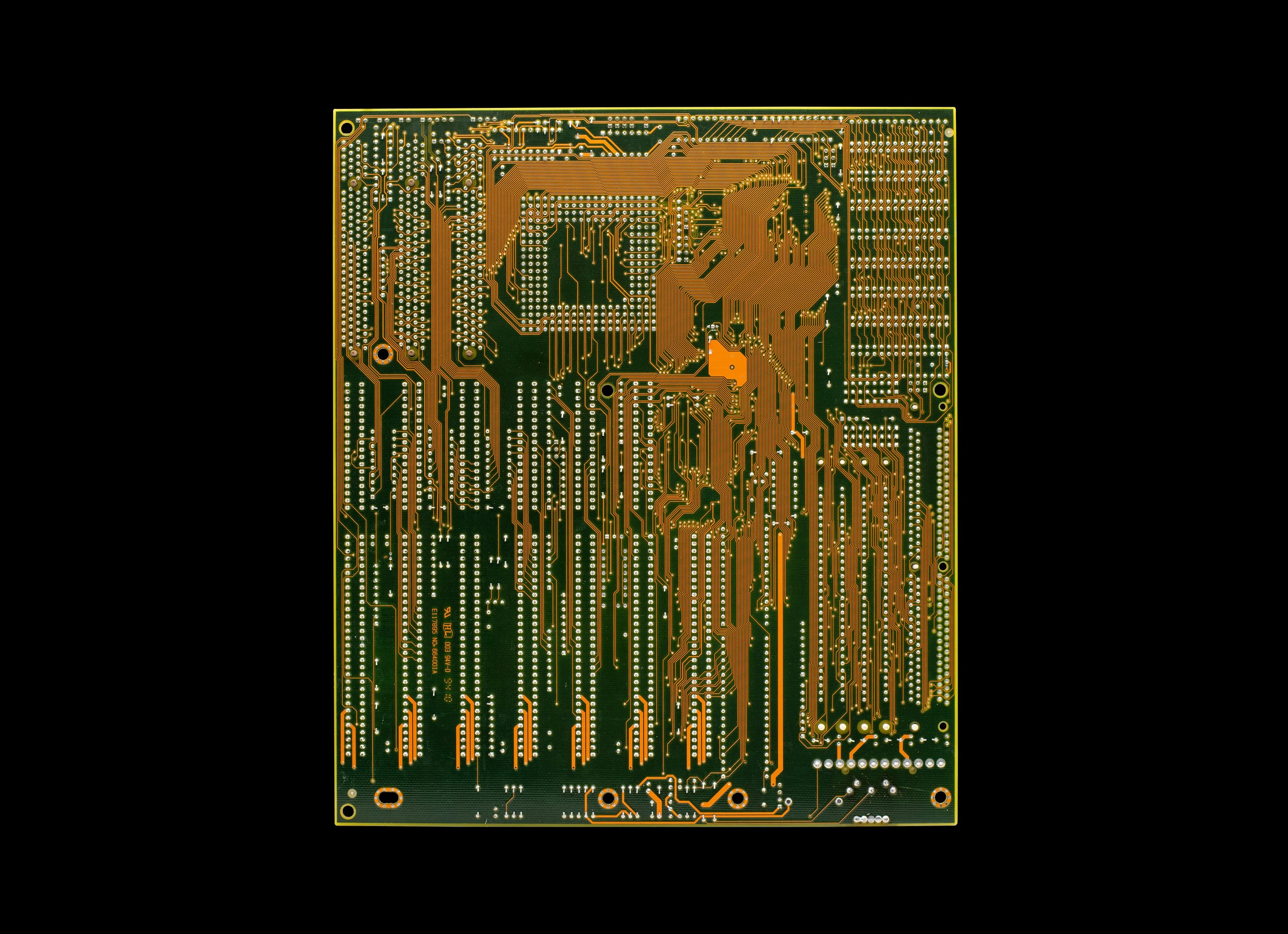 Close-up of a vintage circuit board with intricate electronic traces. Retro style.