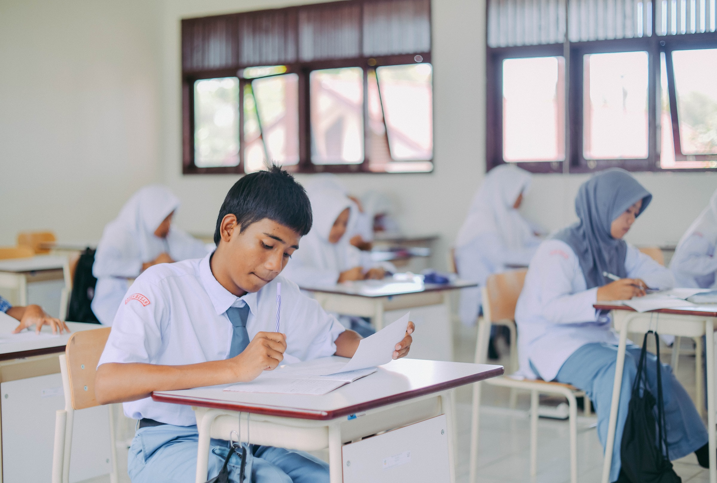 High school students in Indonesia studying in a classroom setting.